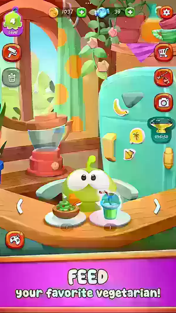 A cute green creature sits in a highchair being fed snacks.